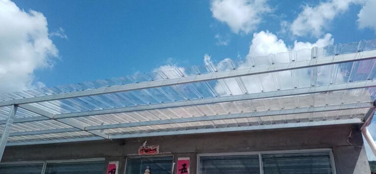 Large-scale PC corrugated sheet roofing installation at a modern industrial facility