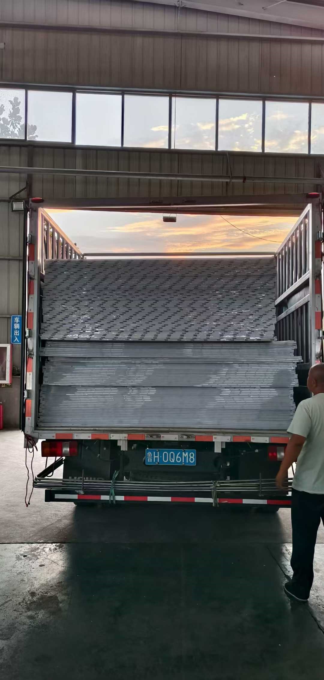 Polycarbonate panels wrapped with protective stretch film and edge foam for shipping