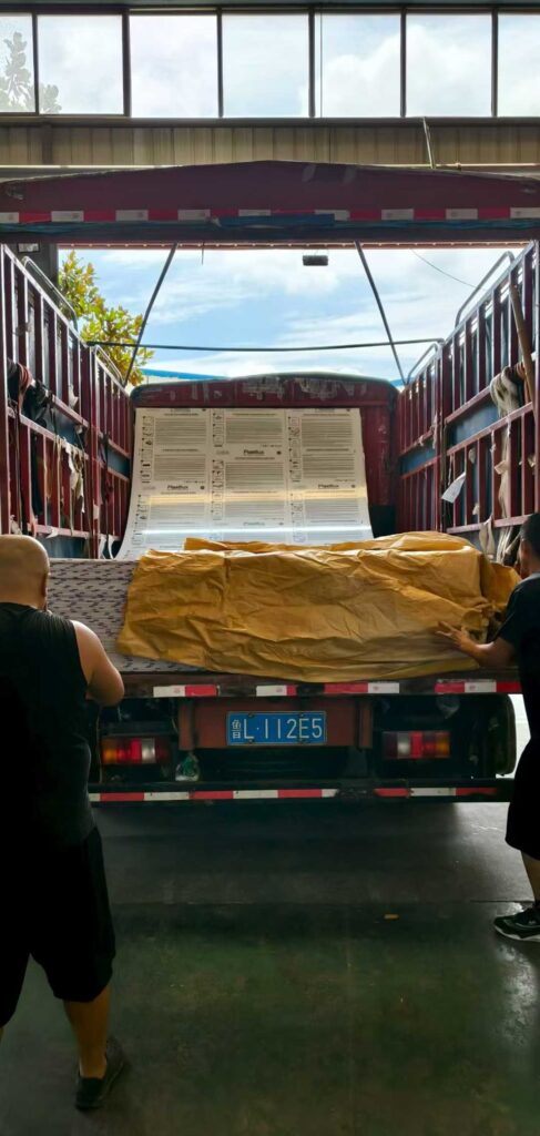 Stacked polycarbonate sheets ready for shipment demonstrating factory quality