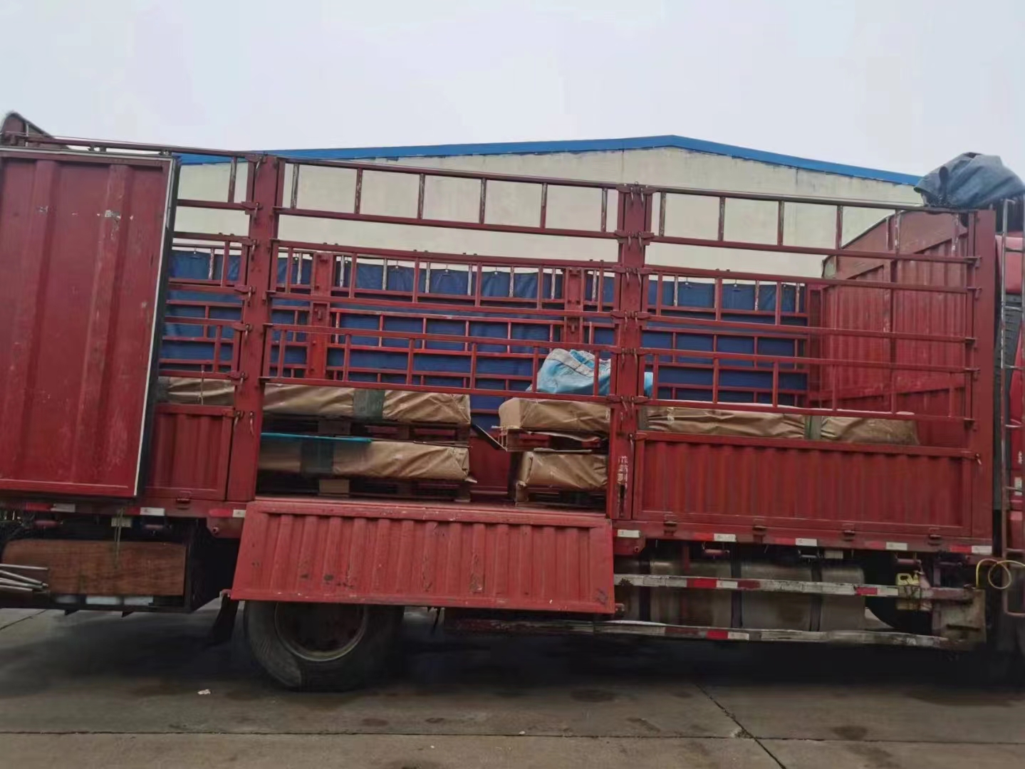 PC polycarbonate sheets securely loaded on flatbed truck for transportation