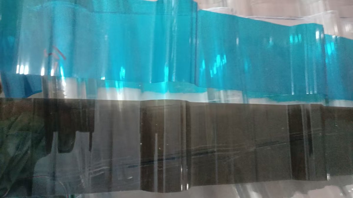Blue-tinted corrugated polycarbonate sheet — a popular color option for residential canopies offering enhanced UV filtering and glare reduction