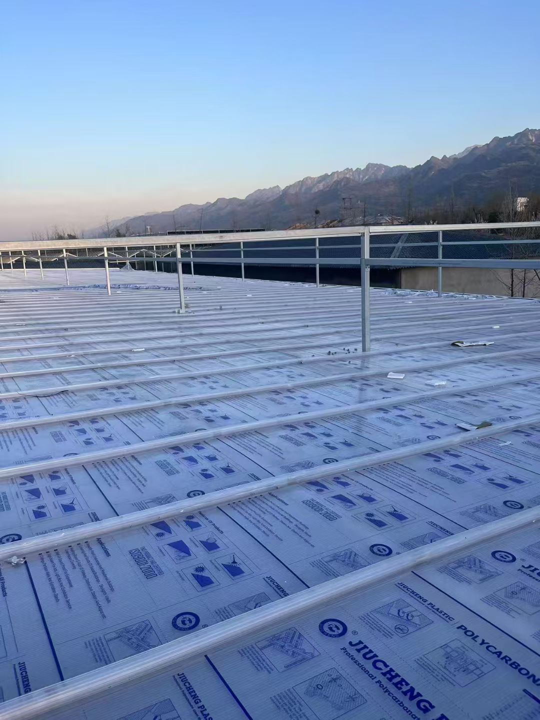 Large polycarbonate skylight roof with mountain view background
