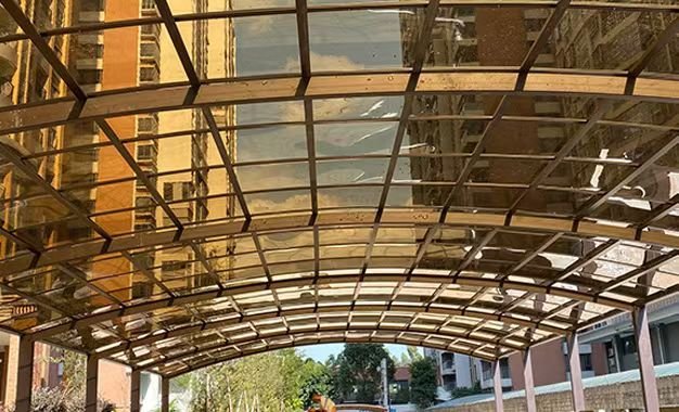 Solid Polycarbonate Sheet Canopy for Commercial Building Entrance — A Modern Architectural Project