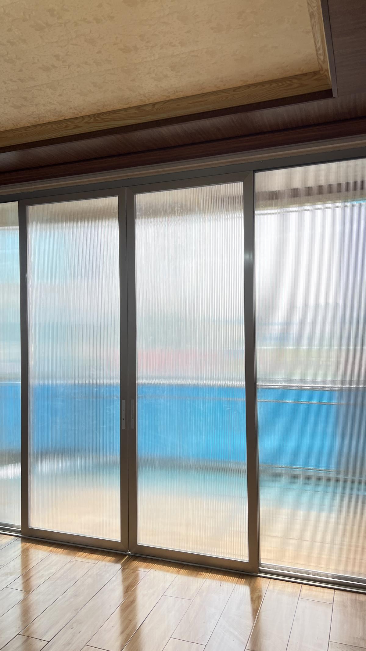 Office interior with polycarbonate sliding doors demonstrating UV-protected glazing in modern architecture