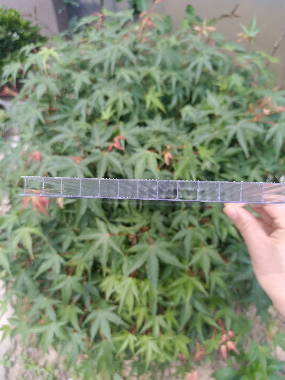 Multiwall polycarbonate sheet cross-section showing hollow twin-wall chambers