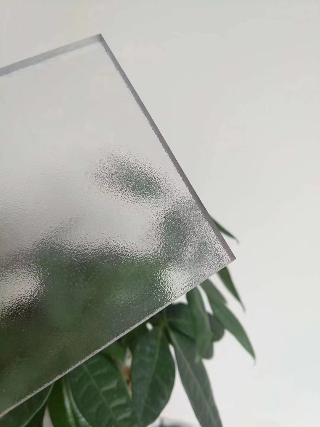 Close-up of the fine matte texture on a frosted polycarbonate sheet