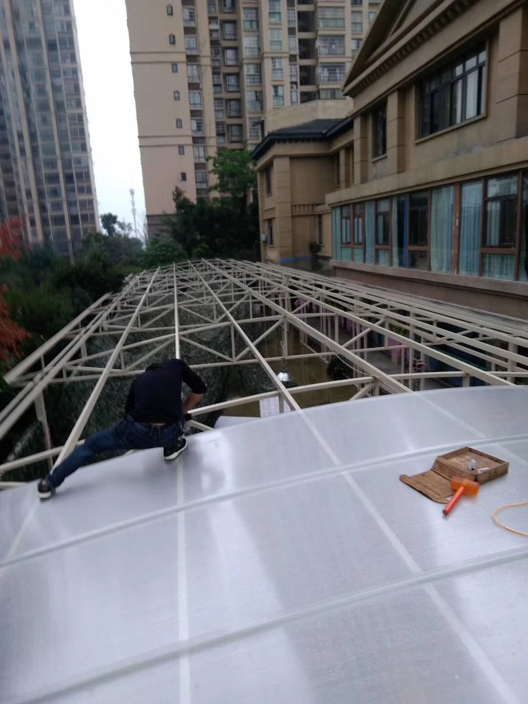 U-Lock polycarbonate daylighting panels being installed on a steel truss