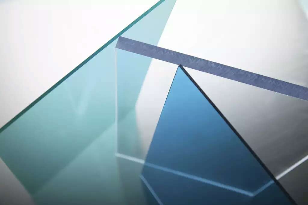 Stacked solid polycarbonate sheets showing clean cut edges and thickness