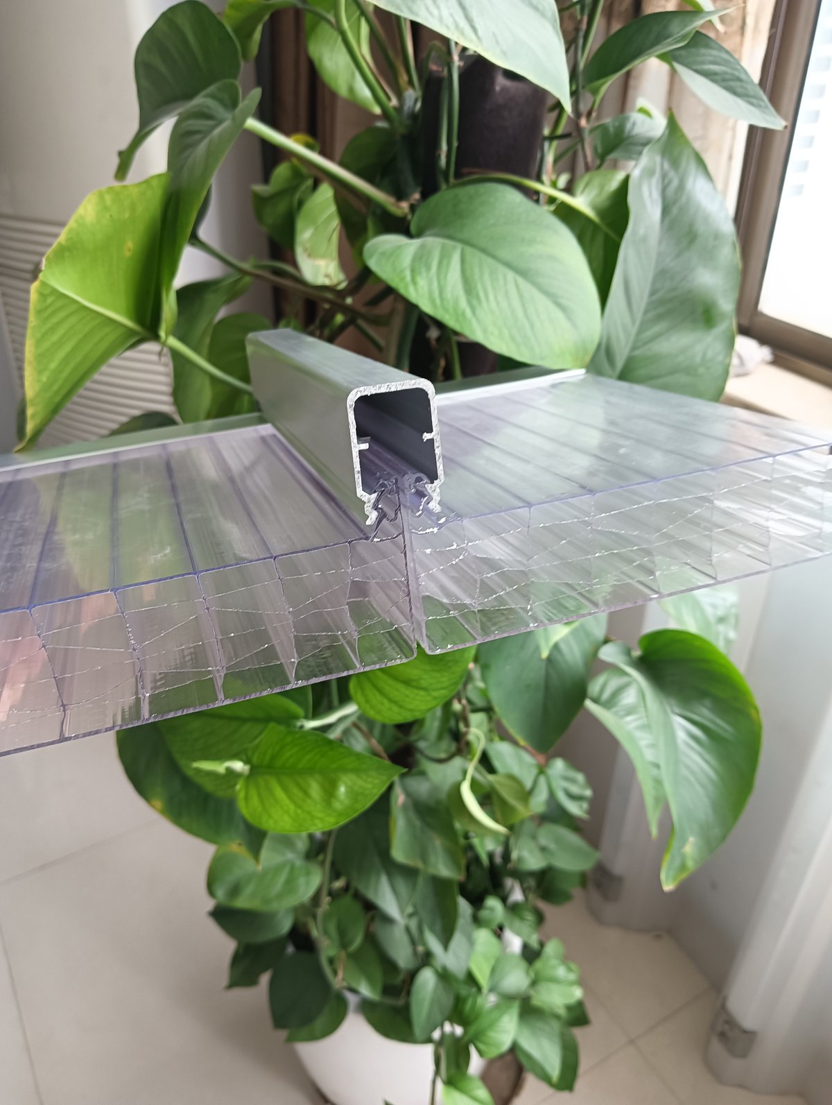 U-Lock polycarbonate panel engaged with its aluminium standing-seam channel
