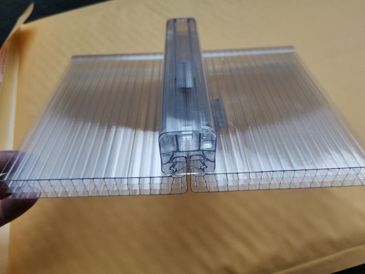 Close-up of a U-lock polycarbonate connector joining two multiwall sheets